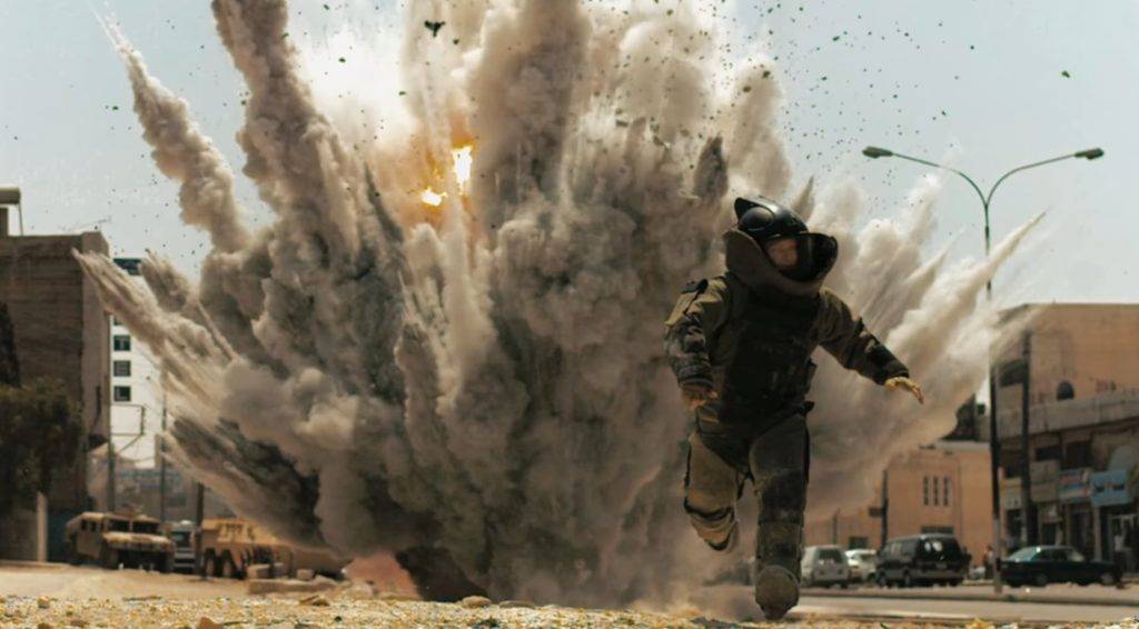 An EOD operator in the film The Hurt Locker running from an explosion while wearing a Med-Eng EOD 10 bomb disposal suit. (Source: YouTube)