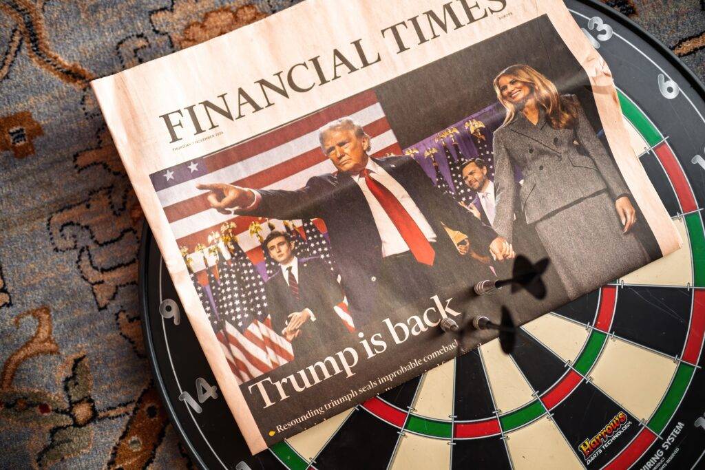 A Financial Times newspaper with the headline Trump is back.