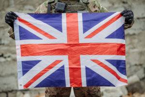 Soldier holding British Flag