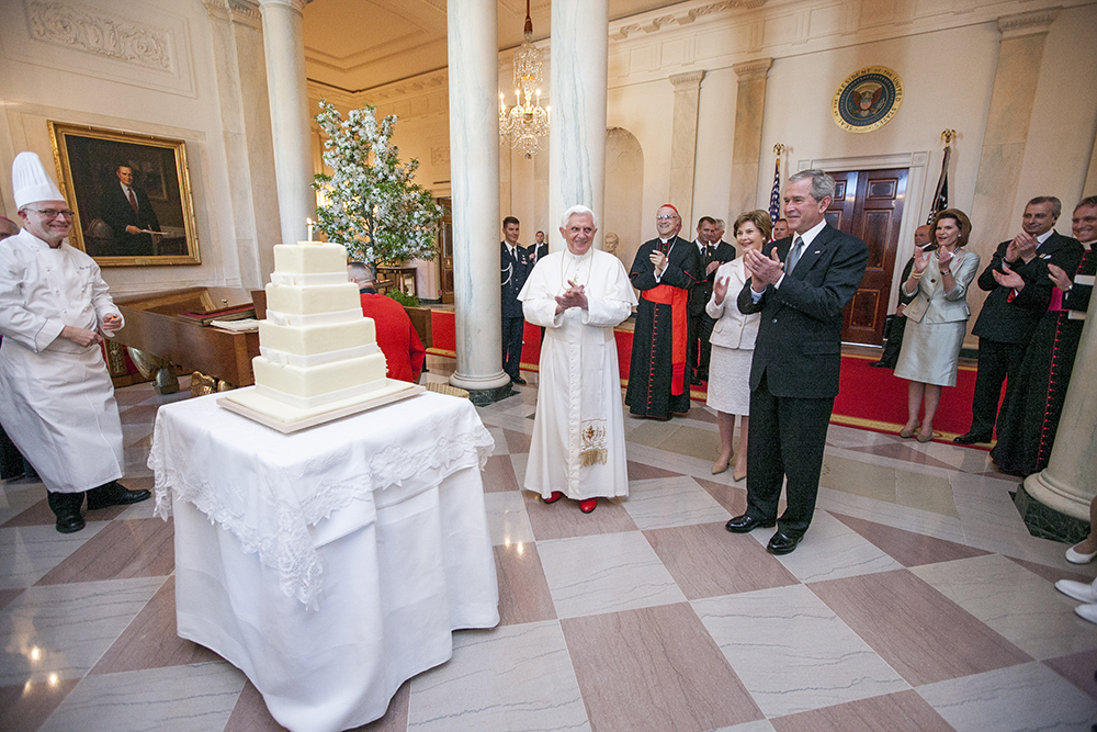 Benedict celebrates his 81st birthday with US president George W. Bush and First Lady Laura Bush at the White House in Washington, D.C., 2008. (Image: Series: Photographs Related to the George W. Bush Administration, 1/20/2001 - 1/20/2009
Collection: Records of the White House Photo Office (George W. Bush Administration), 1/20/2001 - 1/20/2009)
