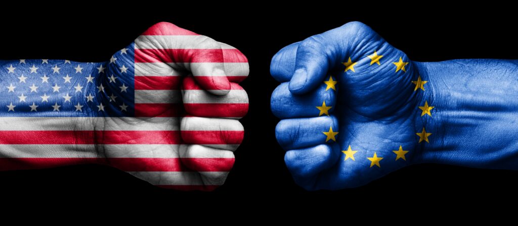american flag fist against european union flag fist. concept of us versus eu in business and trade war